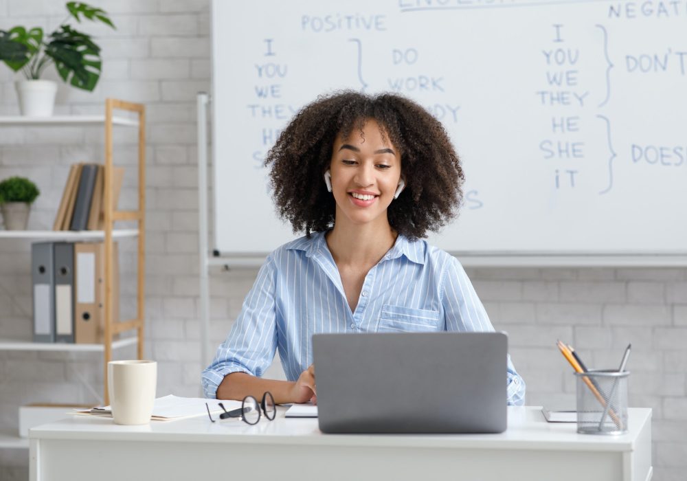 teacher-works-online-during-quarantine-woman-chatting-with-students-at-online-lesson-in-living-room.jpg